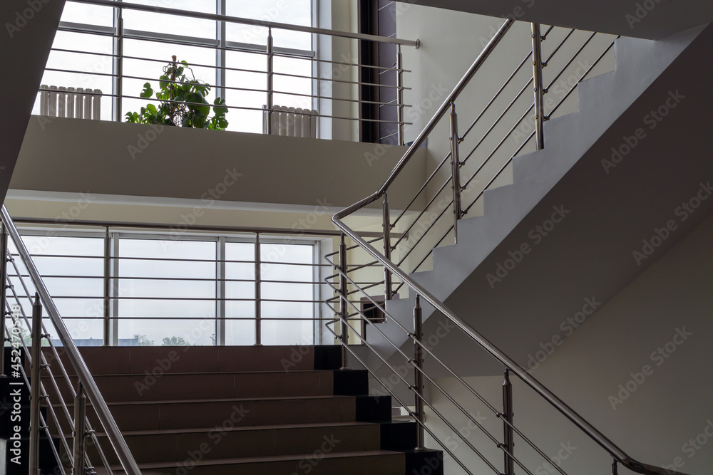 Large windows and stairs in an office building Large windows and stairs in an office building