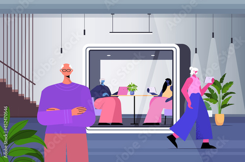 businesspeople working in protective glass cabins business people team in modern office horizontal