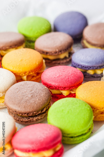 many macaroons on white table