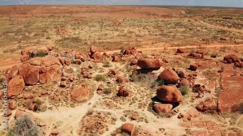 Aerial View Of Giant Granite Boulders At Karlu Karlu. Devils Marbles Conservation Reserve In The Northern Territory Of Australia. drone orbit (approach) photo