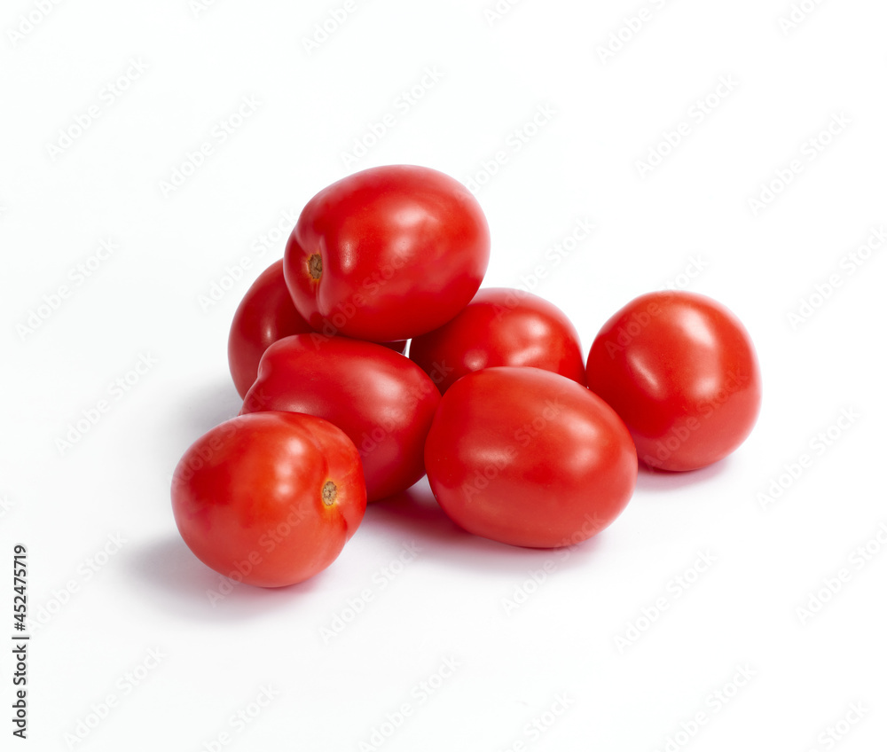 Tomatos on white background. Soft light. Nobody Tomatos on white background. Soft light. Nobody