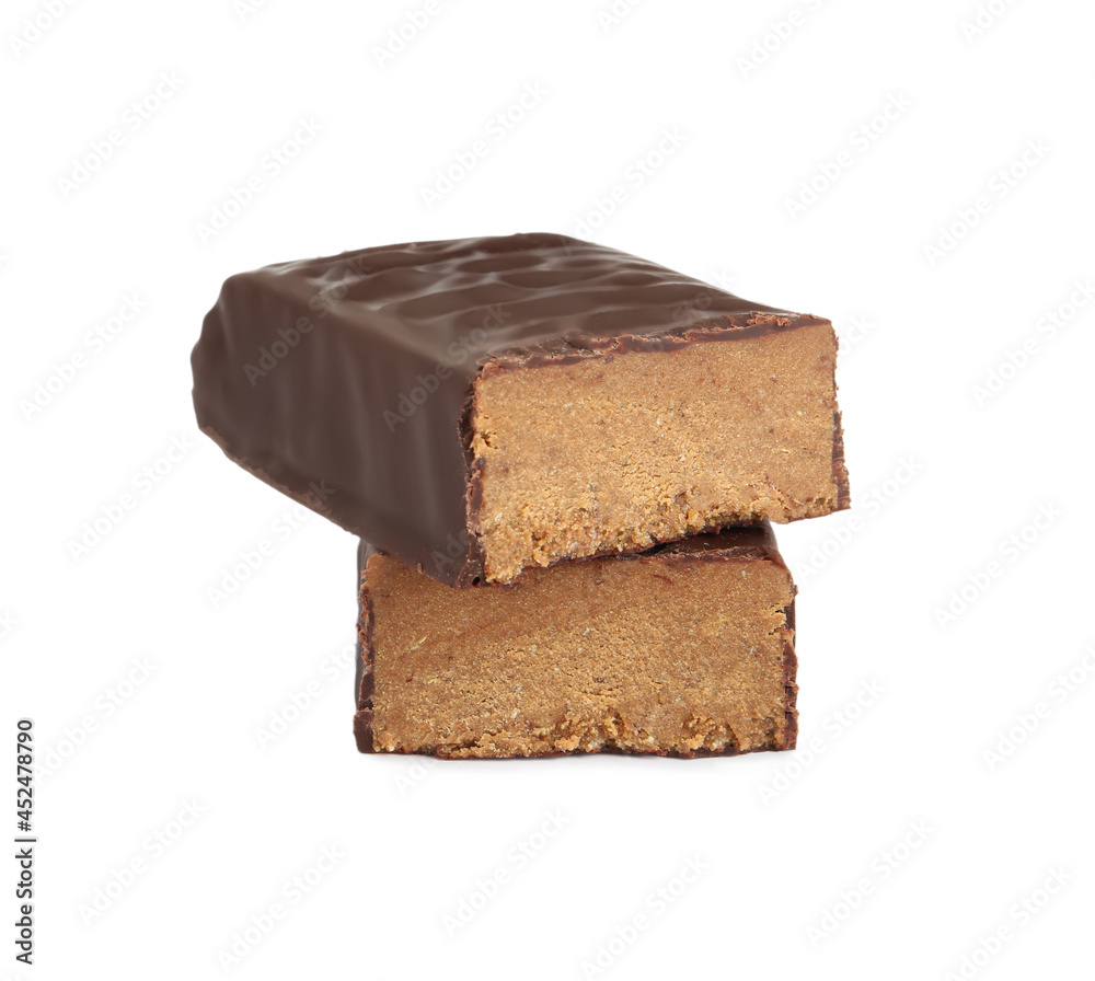 Halves of tasty chocolate glazed protein bar on white background