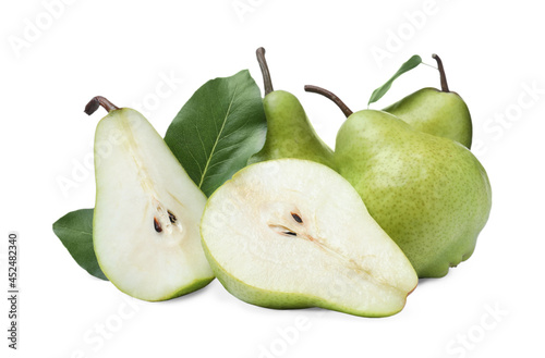 Whole and cut fresh ripe pears on white background