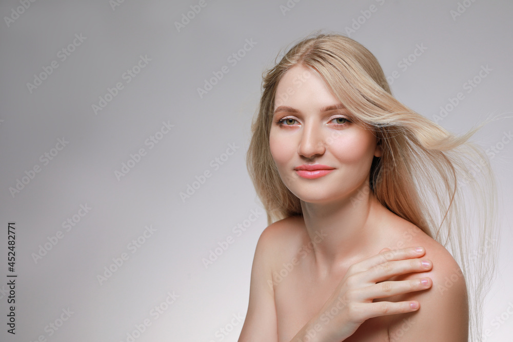 Portrait of young woman with beautiful face on beige background. Space for text Portrait of young woman with beautiful face on beige background. Space for text