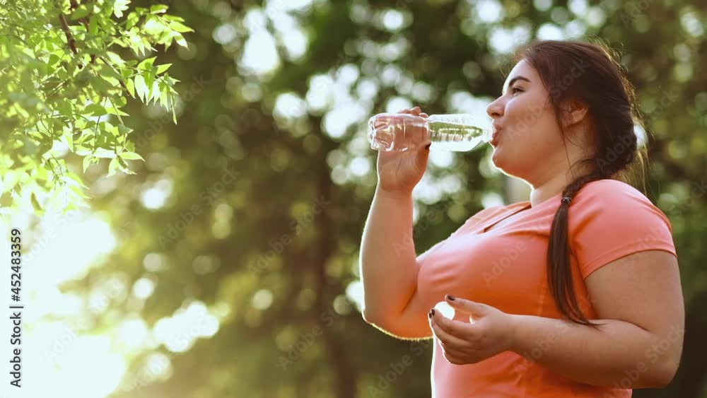 water balance overweight woman drinking forest