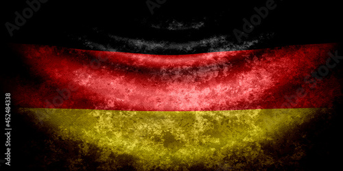 Germany wavy flag in grunge style with darkened edges. Old texture