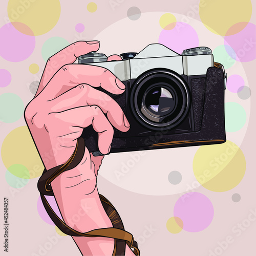 an old camera with a case in your hand