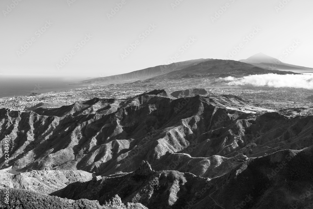 Mountain landscape. View from the observation deck: Mirador Pico del Ingles. In the background Teide volcano. Tenerife, Canary Islands, Spain. Black and white.
