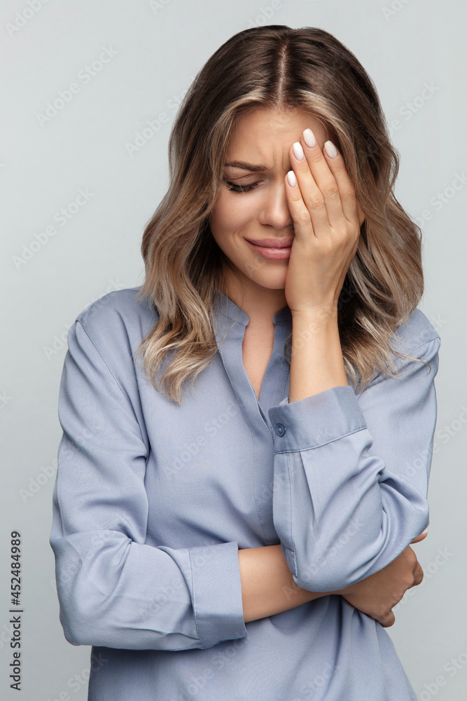 Unhappy young woman cry covering face with hands and embracing herself. Tired stressed female disappointed and upset emotional feel bad after break up or dismissal at work, dissatisfied and depressed Unhappy young woman cry covering face with hands and embracing herself. Tired stressed female disappointed and upset emotional feel bad after break up or dismissal at work, dissatisfied and depressed