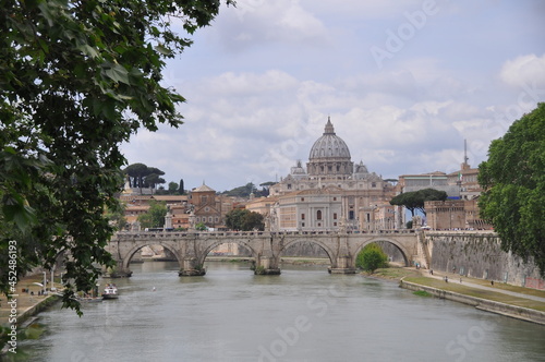 The Papal Basilica of Saint Peter behind Ponte Sant'Angelo on Tyber river, Rome, Italy