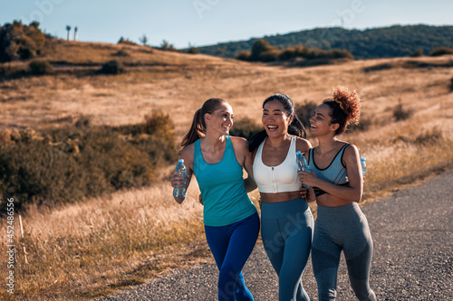 Portrait of three sporty young woman after running outdoors.