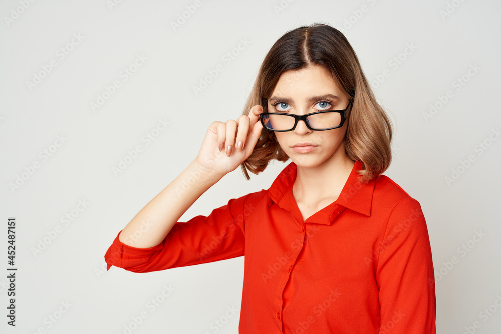 Businesswoman with glasses executive light background