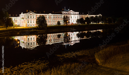 Jelgava castle and refletion at night, Latvia. photo