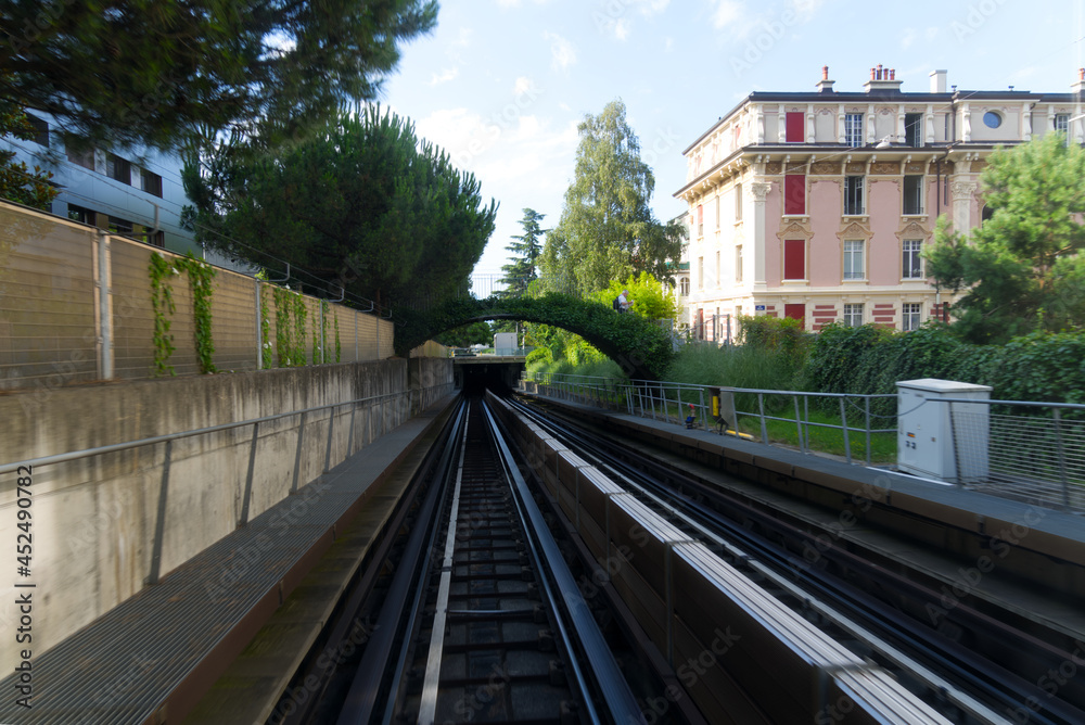 Fototapeta premium Metro tracks at City of Lausanne on a sunny summer day. Photo taken August 11th, 2021, Lausanne, Switzerland.