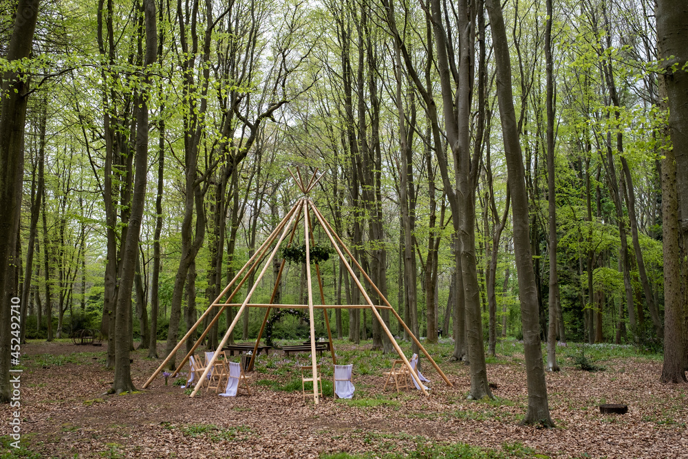 Wooden structure with wreath for a woodland naming ceremony. Wooden structure with wreath for a woodland naming ceremony.