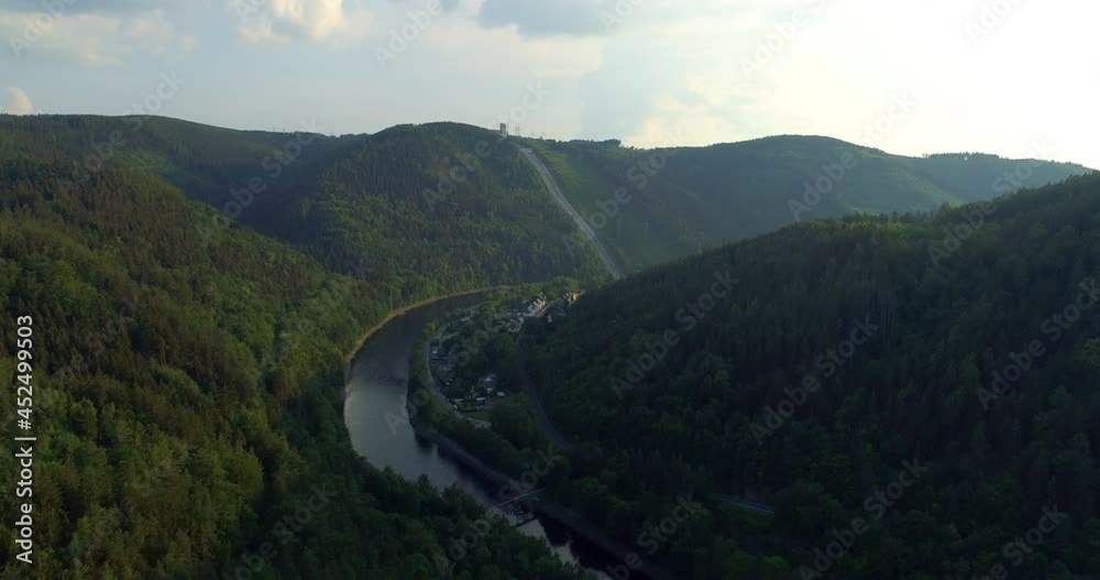 Aerial Forward Scenic View Of Lake Amidst Forest Hills Against Cloudy Sky On Sunny Day - Thuringia, Germany Aerial Forward Scenic View Of Lake Amidst Forest Hills Against Cloudy Sky On Sunny Day - Thuringia, Germany