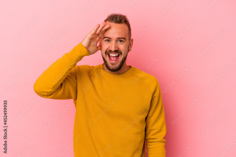 Young caucasian man with tattoos isolated on pink background shouts loud, keeps eyes opened and hands tense. Young caucasian man with tattoos isolated on pink background shouts loud, keeps eyes opened and hands tense.