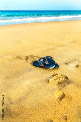 flip flops pon the sand