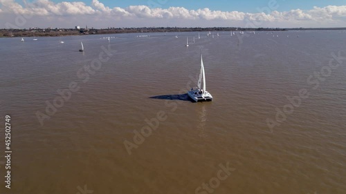 Beautiful day with many sailboats navigating the Rio de la Plata, Buenos Aires, Argentina. photo