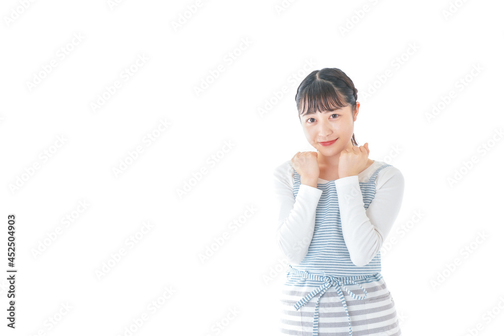 ガッツポーズをする若い主婦 ガッツポーズをする若い主婦