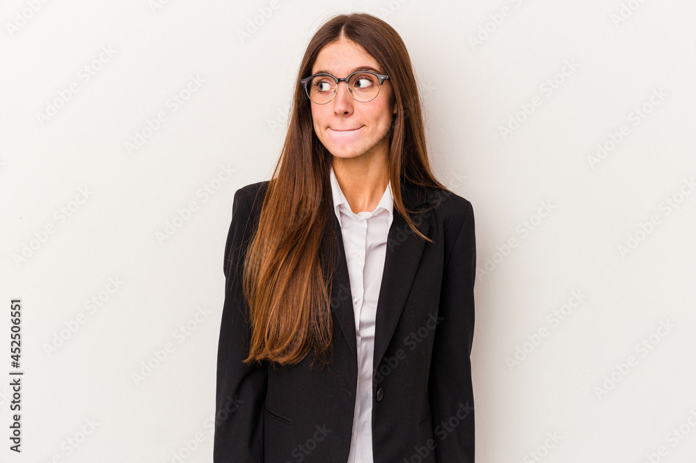 Young caucasian business woman isolated on white background confused, feels doubtful and unsure. Young caucasian business woman isolated on white background confused, feels doubtful and unsure.