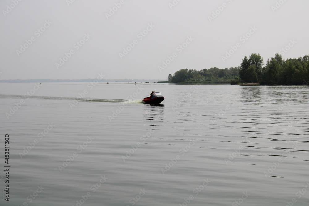 a motor boat is sailing on the Volga