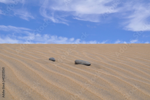 two stones in the sand dunes photo