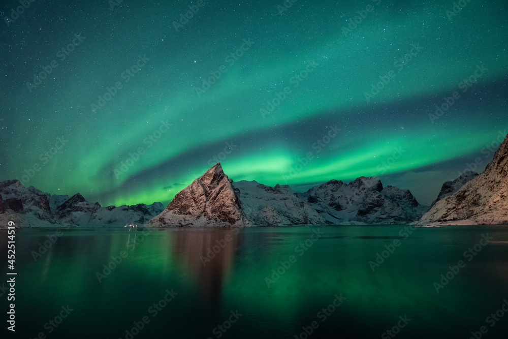 Background, beautiful northern lights in the night sky in Iceland.