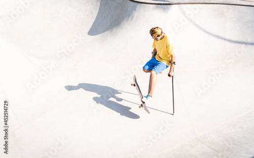 amputated skater spending time at the skatepark photo