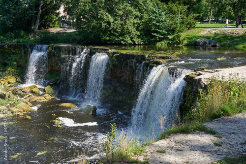 Fototapeta Naklejka Na Ścianę i Meble -  idyllic river landscape in the forest with a waterfall
