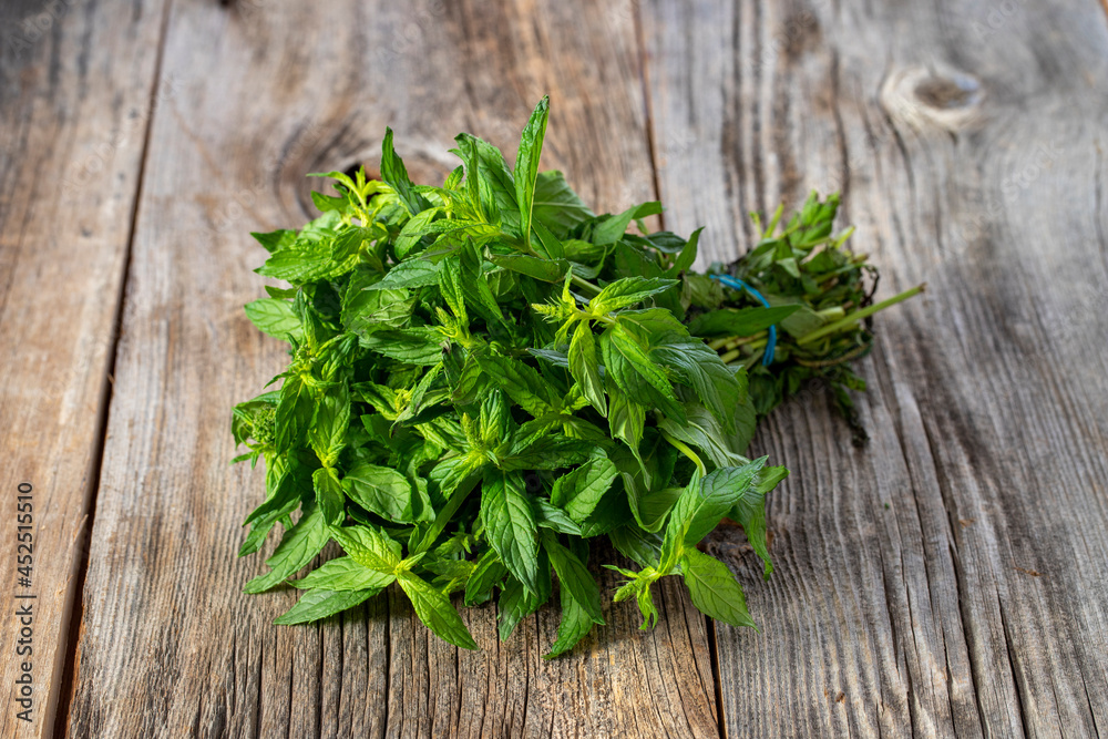 fresh ripe mint on wood background fresh ripe mint on wood background