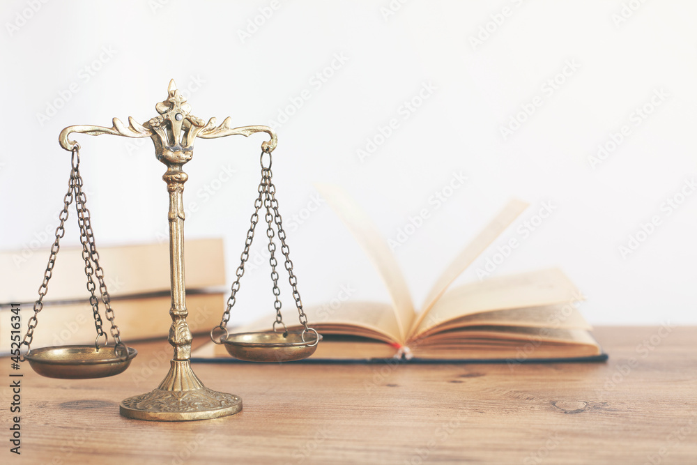 scale of justice,gray background, book and scales of justice on black background scale of justice,gray background, book and scales of justice on black background