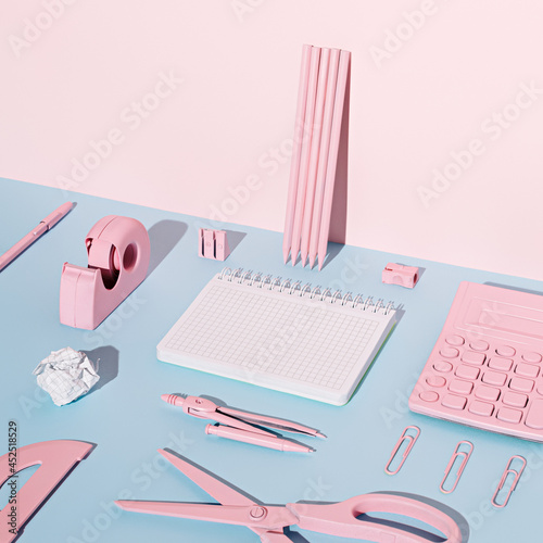 Creative office and school equipment painted in pastel pink color. Collection of graffiti pencils leaning on the wall. Back to school and back to office concept. Minimal aesthetic.