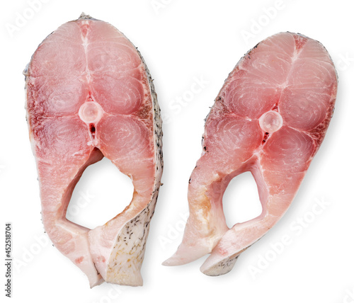 Pieces of fish portioned on a white background, isolated. Top view