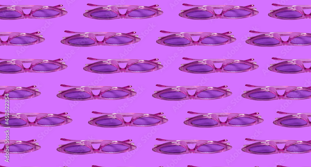 Pattern: sunglasses of bright purple color on a background Pattern: sunglasses of bright purple color on a background