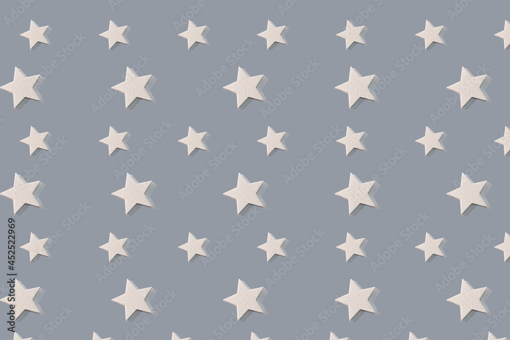 Fototapeta premium Creative pattern photo of decorative products: grey background and stars decor for home