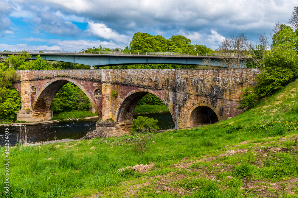 A view towards the Medieval bridge at Leaderfoot in Scotland on a summers day 