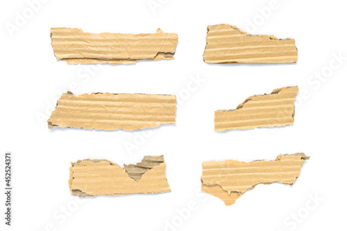 Recycled paper craft stick on a white background. Brown paper torn or ripped pieces of paper isolated on white background. 