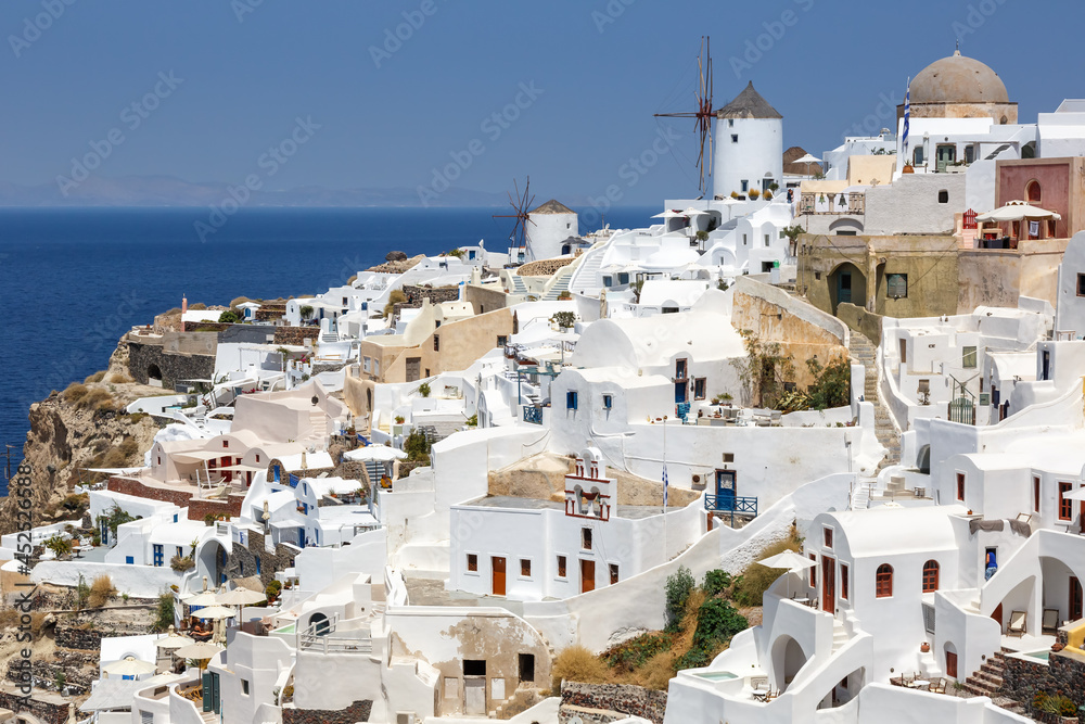 Santorini island holidays in Greece travel traveling Oia town Mediterranean Sea with windmills Santorin