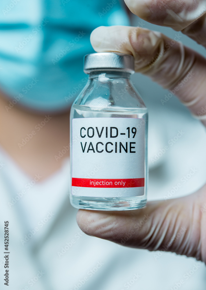 A little single glass bottle vial of new Covid-19 vaccine. Healthcare concept vaccination injection treatment. A little single glass bottle vial of new Covid-19 vaccine. Healthcare concept vaccination injection treatment.