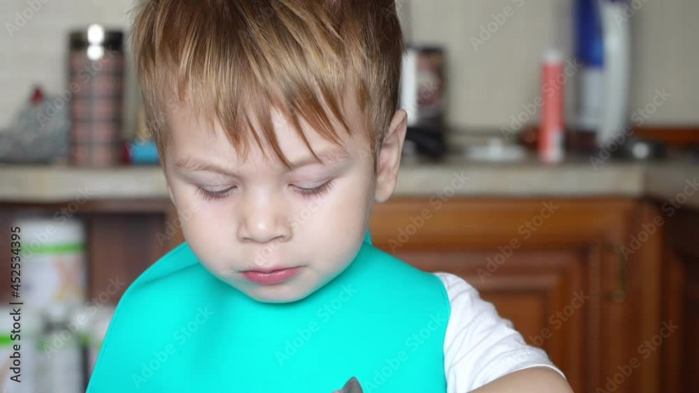 Boy eating boiled corn Boy eating boiled corn