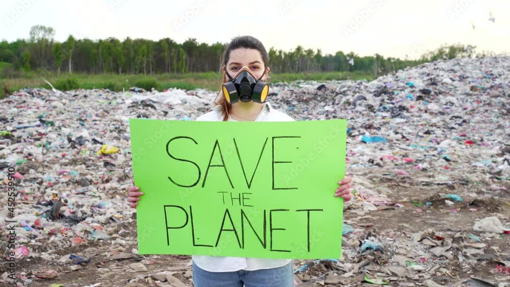 portrait young woman activist with a poster in hands save earth stands ...