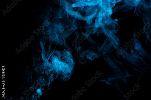 Blue abstract smoke isolated on black background, cloud of steam on dark background