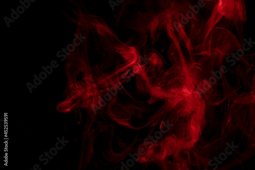 Abstract red smoke on a black background. The steam generator. The concept of poison gas. 