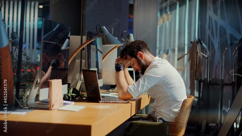 Tired Businessman Works In Night Office.Office Worker Overtime Work In Internet.Workaholic Deadline.Tired Worker Overworked On Computer.Frustrated Businessman Working Alone.Overwhelmed Stressed Man.