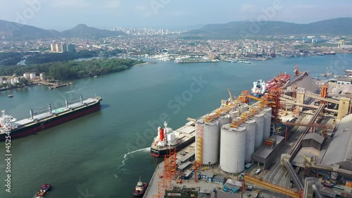 Maritime transport in Santos Port, Sao Paulo, Brazil. Freight ship sailing at the bay.Maritime transport in Santos Port, Sao Paulo, Brazil.Freight ship sailing at the bay.Maritime transport in Santos. photo