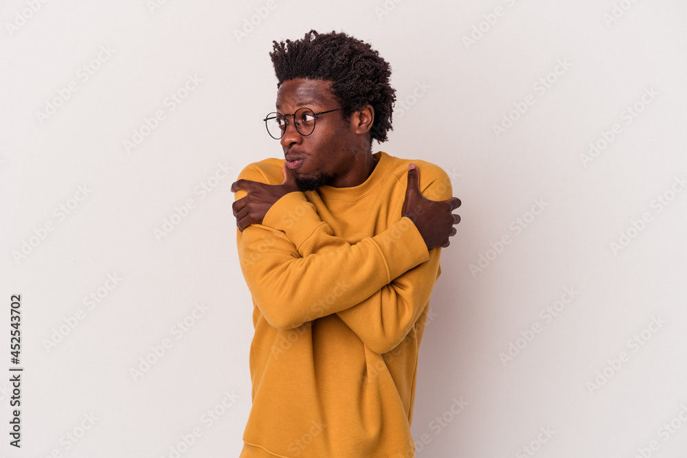 Young african american man isolated on white background hugs, smiling carefree and happy. Young african american man isolated on white background hugs, smiling carefree and happy.