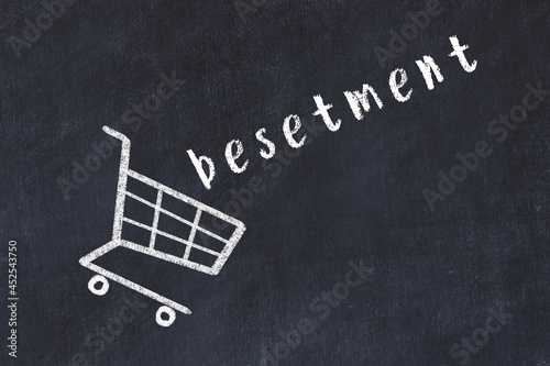 Chalk drawing of shopping cart and word besetment on black chalboard. Concept of globalization and mass consuming