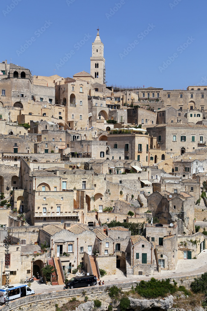 Fototapeta premium Matera, Italy - August 17, 2020: View of the Sassi di Matera a historic district in the city of Matera, well-known for their ancient cave dwellings. Basilicata. Italy