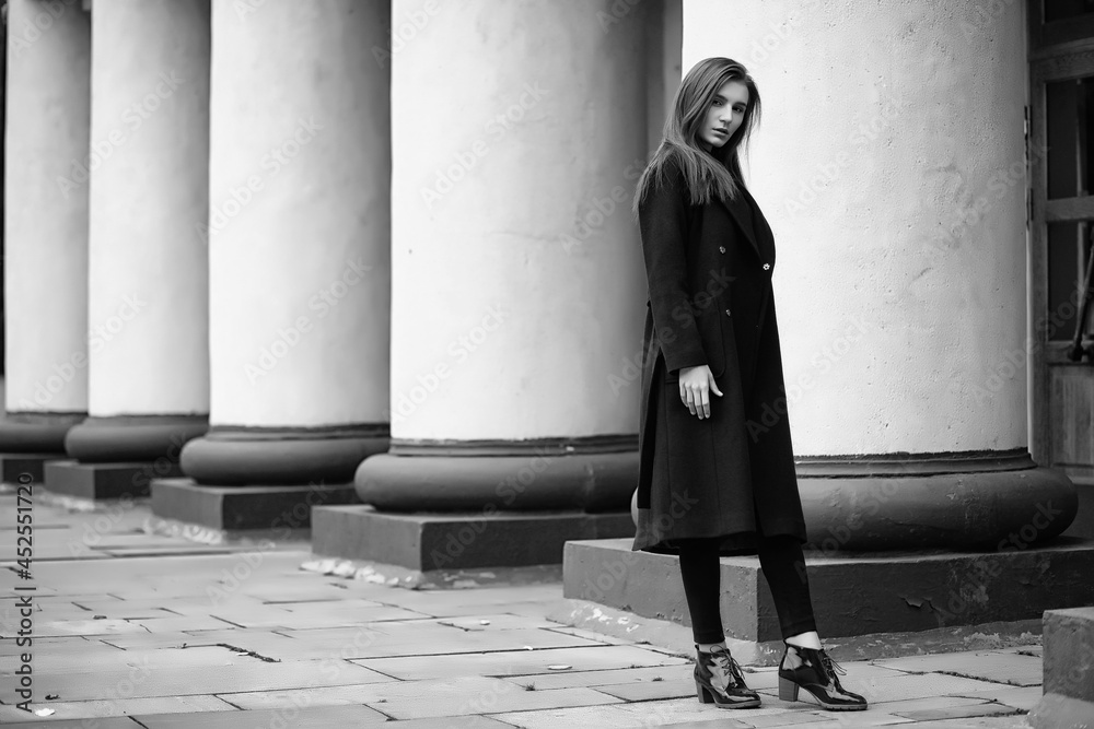 Obraz premium Girl in a coat black and white photo
